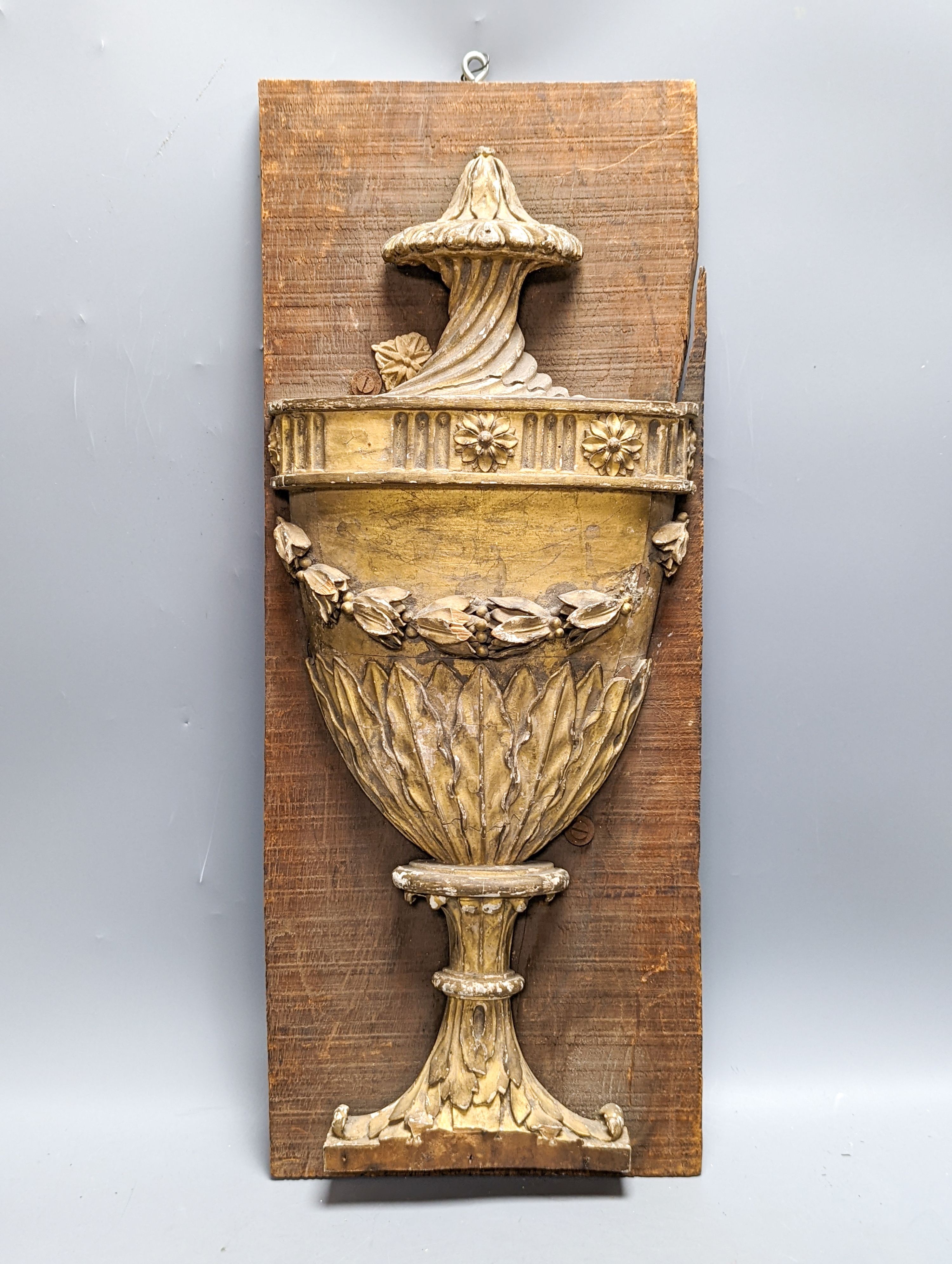 An 18th/19th century carved wood and gilt gesso urn relief, later mounted, 57x23cm